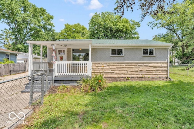 6305 Vigo Dr, Clayton, IN 46118 - ranch-style house with stone siding, a porch, and a metal roof