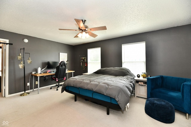 2016 Morning Light Ln, Greenwood, IN 46143 - carpeted bedroom featuring multiple windows, a desk, a textured ceiling, and a ceiling fan