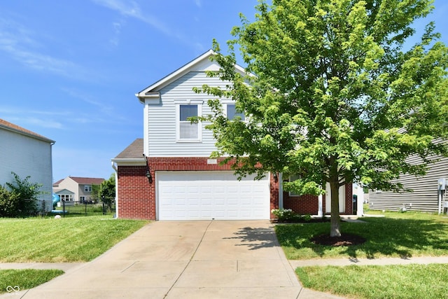 2016 Morning Light Ln, Greenwood, IN 46143 - view of front of home featuring brick siding, driveway, and a garage