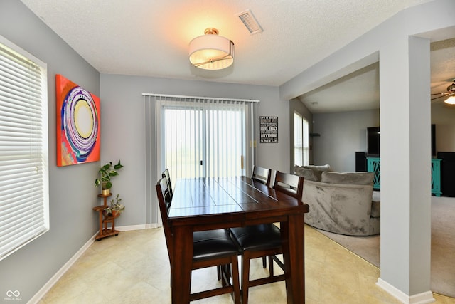 2016 Morning Light Ln, Greenwood, IN 46143 - dining room featuring a ceiling fan and a textured ceiling