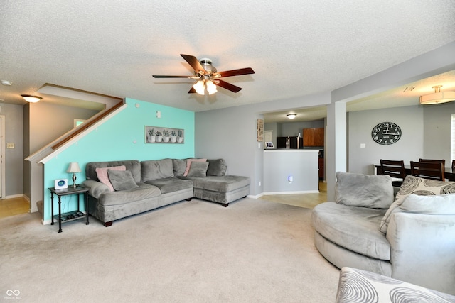 2016 Morning Light Ln, Greenwood, IN 46143 - living area featuring ceiling fan, carpet floors, and a textured ceiling