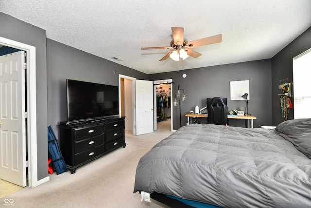 2016 Morning Light Ln, Greenwood, IN 46143 - bedroom with light carpet, a textured ceiling, ceiling fan, a spacious closet, and a closet