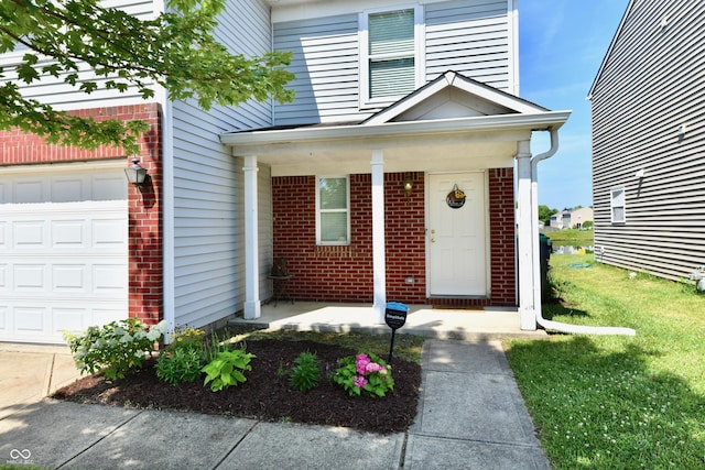 2016 Morning Light Ln, Greenwood, IN 46143 - entrance to property featuring brick siding, an attached garage, and a porch