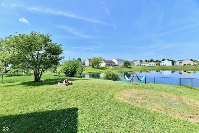 2016 Morning Light Ln, Greenwood, IN 46143 - view of yard featuring a residential view, an outdoor fire pit, and a water view