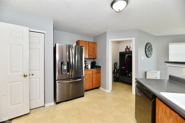 2016 Morning Light Ln, Greenwood, IN 46143 - kitchen with stainless steel fridge with ice dispenser, dishwasher, brown cabinetry, a textured ceiling, and dark countertops