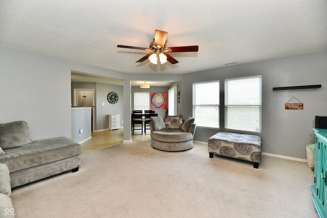 2016 Morning Light Ln, Greenwood, IN 46143 - carpeted living area featuring a ceiling fan and a textured ceiling