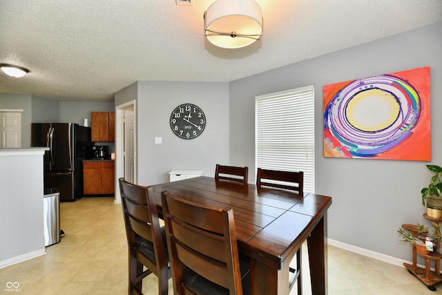 2016 Morning Light Ln, Greenwood, IN 46143 - dining space with baseboards and a textured ceiling