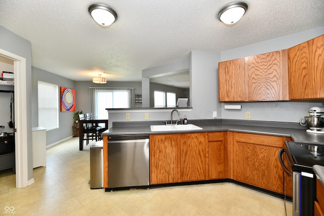 2016 Morning Light Ln, Greenwood, IN 46143 - kitchen with stainless steel dishwasher, a peninsula, brown cabinets, electric stove, and a textured ceiling