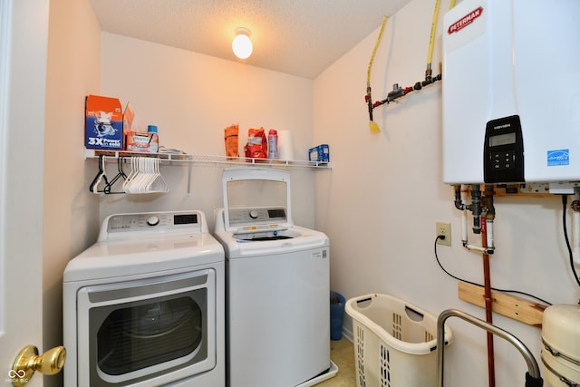 2016 Morning Light Ln, Greenwood, IN 46143 - laundry area with water heater, washing machine and clothes dryer, and a textured ceiling