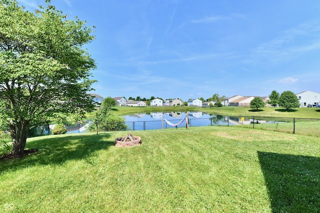 2016 Morning Light Ln, Greenwood, IN 46143 - view of yard featuring a residential view, a water view, and a fire pit