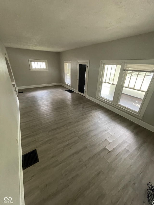849 S Belleview Pl, Indianapolis, IN 46221 - unfurnished living room with dark wood finished floors