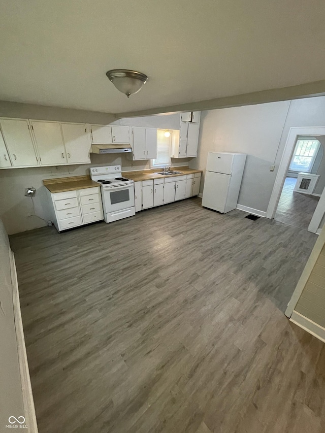 849 S Belleview Pl, Indianapolis, IN 46221 - kitchen featuring white appliances, dark wood-style floors, white cabinetry, and under cabinet range hood