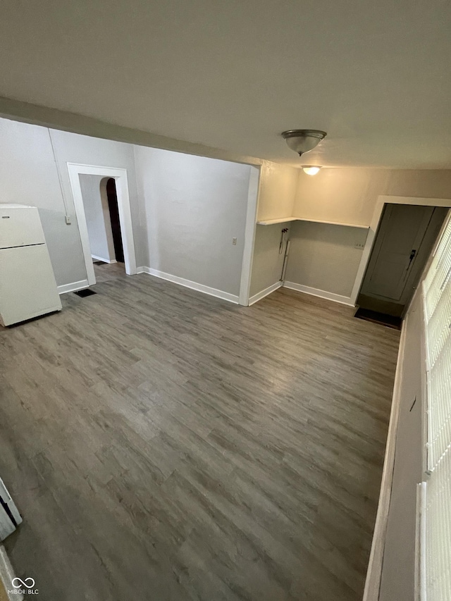 849 S Belleview Pl, Indianapolis, IN 46221 - unfurnished living room with wood finished floors and arched walkways