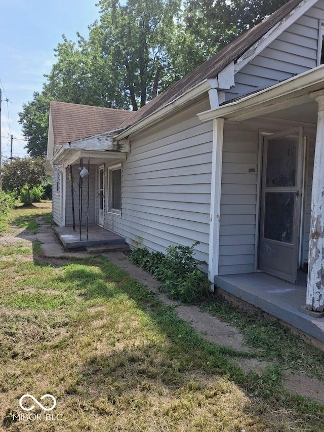 2245 Union St, Indianapolis, IN 46225 - view of side of property featuring covered porch and a lawn