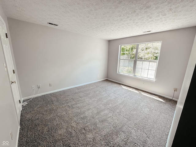 9672 River Oak Ln E, Fishers, IN 46038 - spare room featuring carpet floors and a textured ceiling