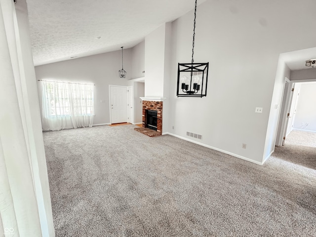 9672 River Oak Ln E, Fishers, IN 46038 - unfurnished living room with carpet floors, a fireplace, a textured ceiling, and high vaulted ceiling