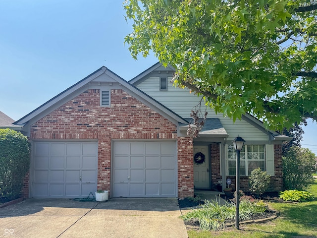9672 River Oak Ln E, Fishers, IN 46038 - view of front of home with driveway, brick siding, and a garage