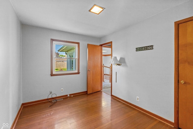 320 S Odell St, Brownsburg, IN 46112 - unfurnished bedroom with hardwood / wood-style flooring and baseboards
