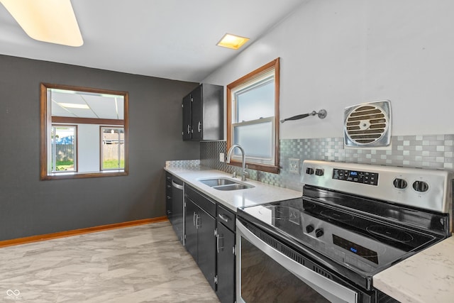 320 S Odell St, Brownsburg, IN 46112 - kitchen featuring appliances with stainless steel finishes, dark cabinets, tasteful backsplash, and light marble finish floors