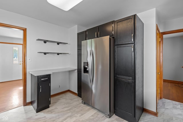 320 S Odell St, Brownsburg, IN 46112 - kitchen featuring stainless steel fridge, light marble finish floors, and light countertops