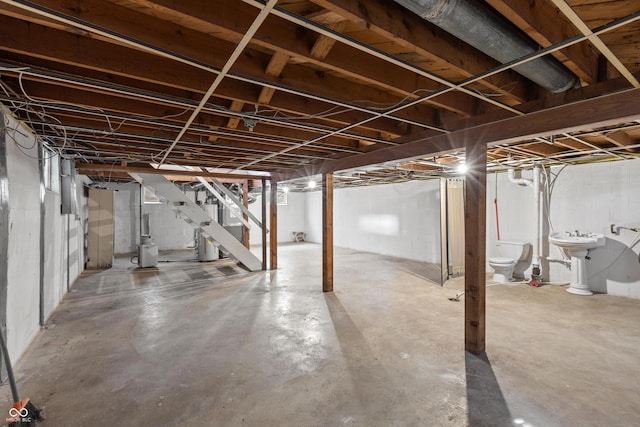 320 S Odell St, Brownsburg, IN 46112 - unfinished below grade area featuring stairs and water heater