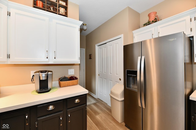 1603 Oakmere Way, Greenwood, IN 46142 - kitchen with stainless steel refrigerator with ice dispenser, white cabinetry, light wood-type flooring, and light countertops
