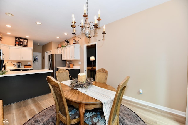 1603 Oakmere Way, Greenwood, IN 46142 - dining space with light wood-style flooring, a chandelier, and recessed lighting