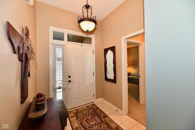 1603 Oakmere Way, Greenwood, IN 46142 - entryway with light tile patterned floors and light colored carpet