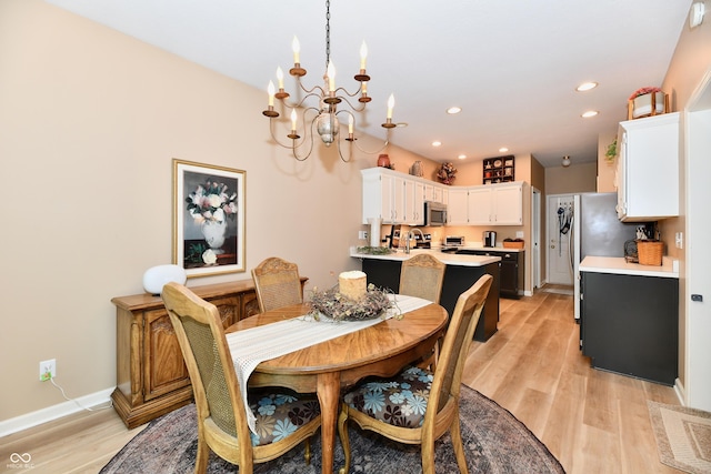 1603 Oakmere Way, Greenwood, IN 46142 - dining area featuring a chandelier, light wood finished floors, and recessed lighting