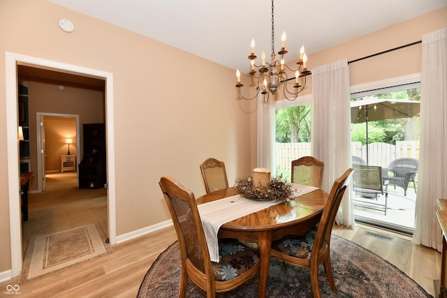 1603 Oakmere Way, Greenwood, IN 46142 - dining space featuring a chandelier and light wood finished floors