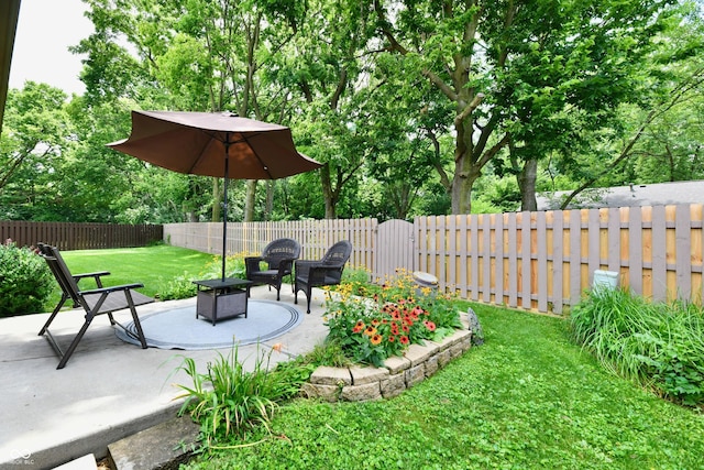 1603 Oakmere Way, Greenwood, IN 46142 - fenced backyard featuring a patio, an outdoor fire pit, and view of wooded area