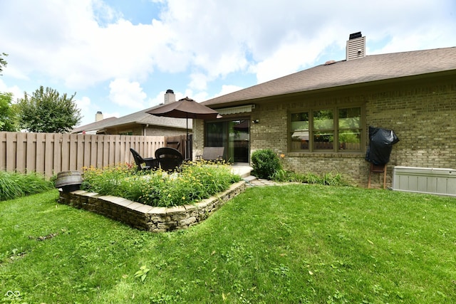 1603 Oakmere Way, Greenwood, IN 46142 - rear view of house featuring brick siding and a chimney