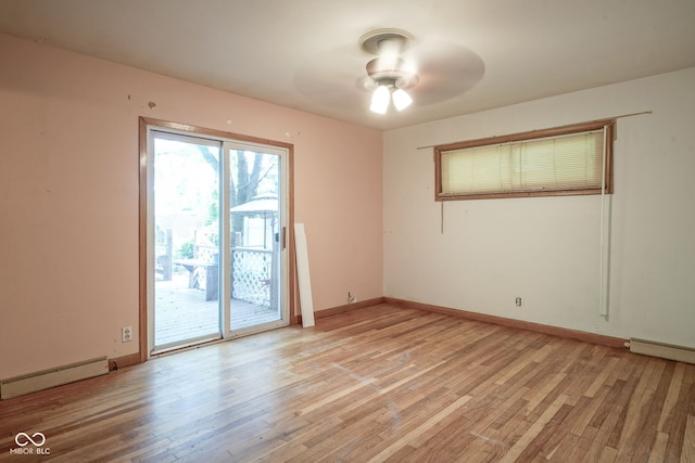 4720 Kessler View Dr, Indianapolis, IN 46220 - spare room with a baseboard heating unit, light wood finished floors, and ceiling fan
