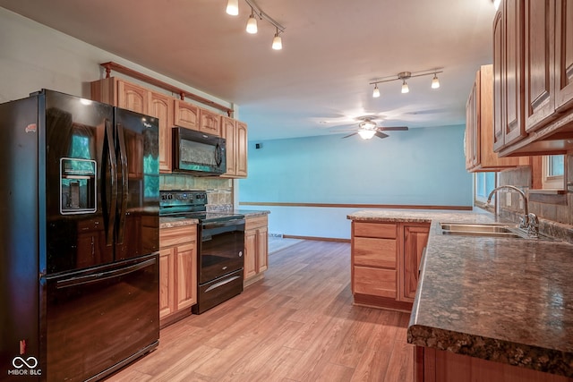 4720 Kessler View Dr, Indianapolis, IN 46220 - kitchen featuring black appliances, a ceiling fan, light wood finished floors, tasteful backsplash, and rail lighting