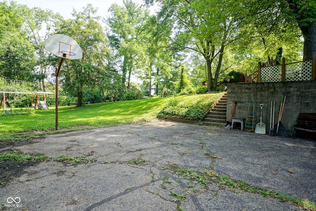 4720 Kessler View Dr, Indianapolis, IN 46220 - view of patio featuring a playground, view of scattered trees, and stairs