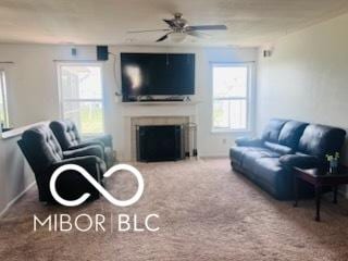 19519 Prairie Crossing Dr, Noblesville, IN 46062 - carpeted living room featuring ceiling fan and a fireplace