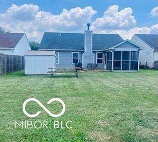 19519 Prairie Crossing Dr, Noblesville, IN 46062 - rear view of house with a chimney, a storage shed, and a sunroom