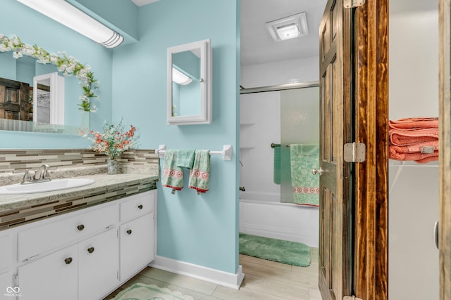 2571 Stonybrook Ln, Franklin, IN 46131 - bathroom featuring vanity, bath / shower combo with glass door, and tasteful backsplash