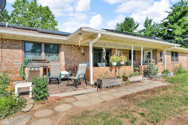 2571 Stonybrook Ln, Franklin, IN 46131 - view of front of home with a porch, solar panels, and brick siding