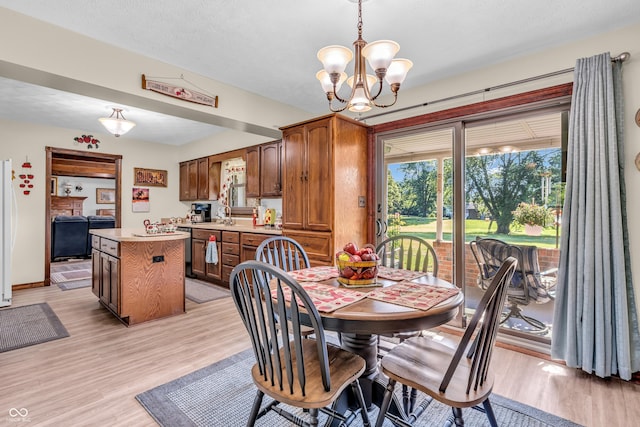 2571 Stonybrook Ln, Franklin, IN 46131 - dining room featuring a chandelier and light wood-style floors