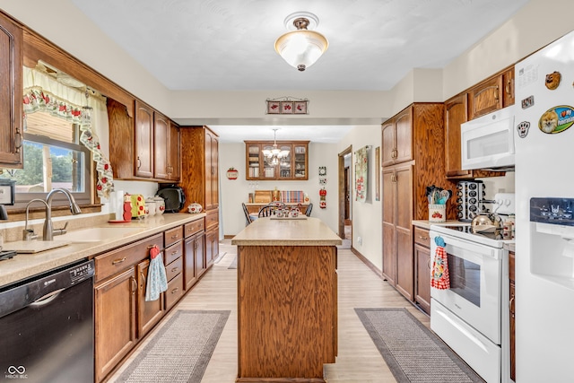 2571 Stonybrook Ln, Franklin, IN 46131 - kitchen with white appliances, a center island, light countertops, brown cabinetry, and light wood finished floors