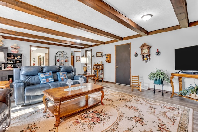2571 Stonybrook Ln, Franklin, IN 46131 - living area with beam ceiling, light wood finished floors, and a textured ceiling