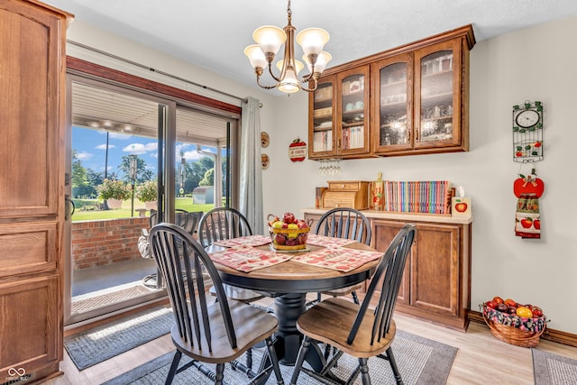 2571 Stonybrook Ln, Franklin, IN 46131 - dining space featuring a chandelier and light wood-type flooring