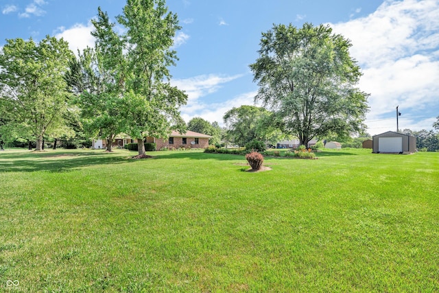2571 Stonybrook Ln, Franklin, IN 46131 - view of green lawn with a detached garage and an outdoor structure
