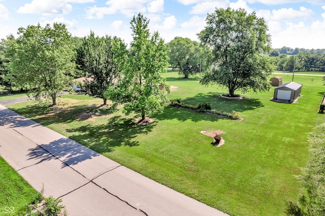 2571 Stonybrook Ln, Franklin, IN 46131 - view of community featuring an outbuilding, a yard, and view of wooded area