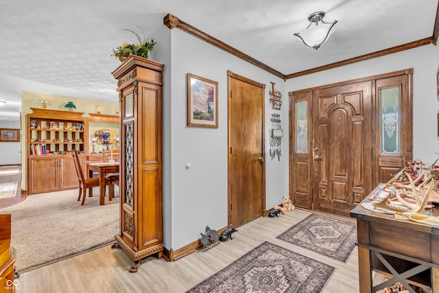 2571 Stonybrook Ln, Franklin, IN 46131 - entryway featuring light wood-type flooring and ornamental molding