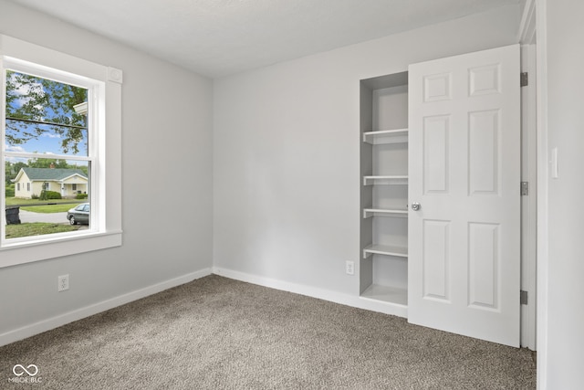 135 S Dr, Anderson, IN 46013 - unfurnished bedroom with carpet floors and baseboards