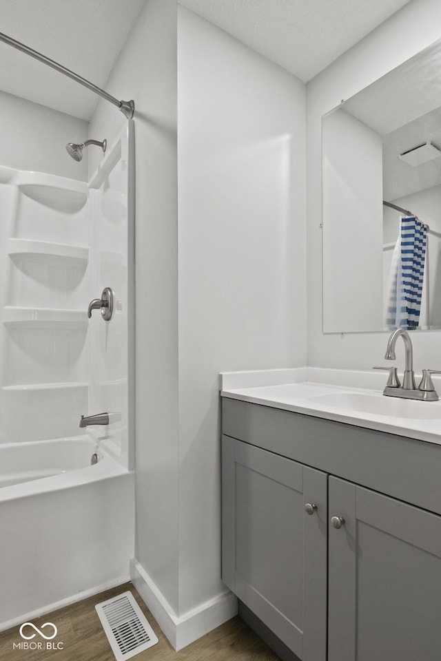 135 S Dr, Anderson, IN 46013 - full bath featuring vanity, wood finished floors, and shower / bath combination with curtain
