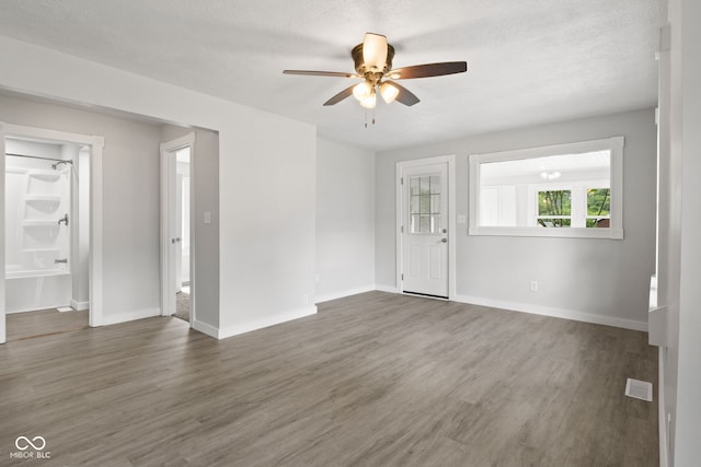 135 S Dr, Anderson, IN 46013 - spare room with a ceiling fan and wood finished floors