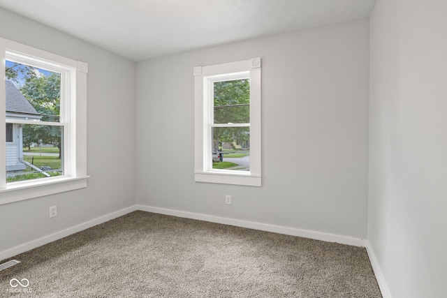 135 S Dr, Anderson, IN 46013 - carpeted empty room featuring plenty of natural light